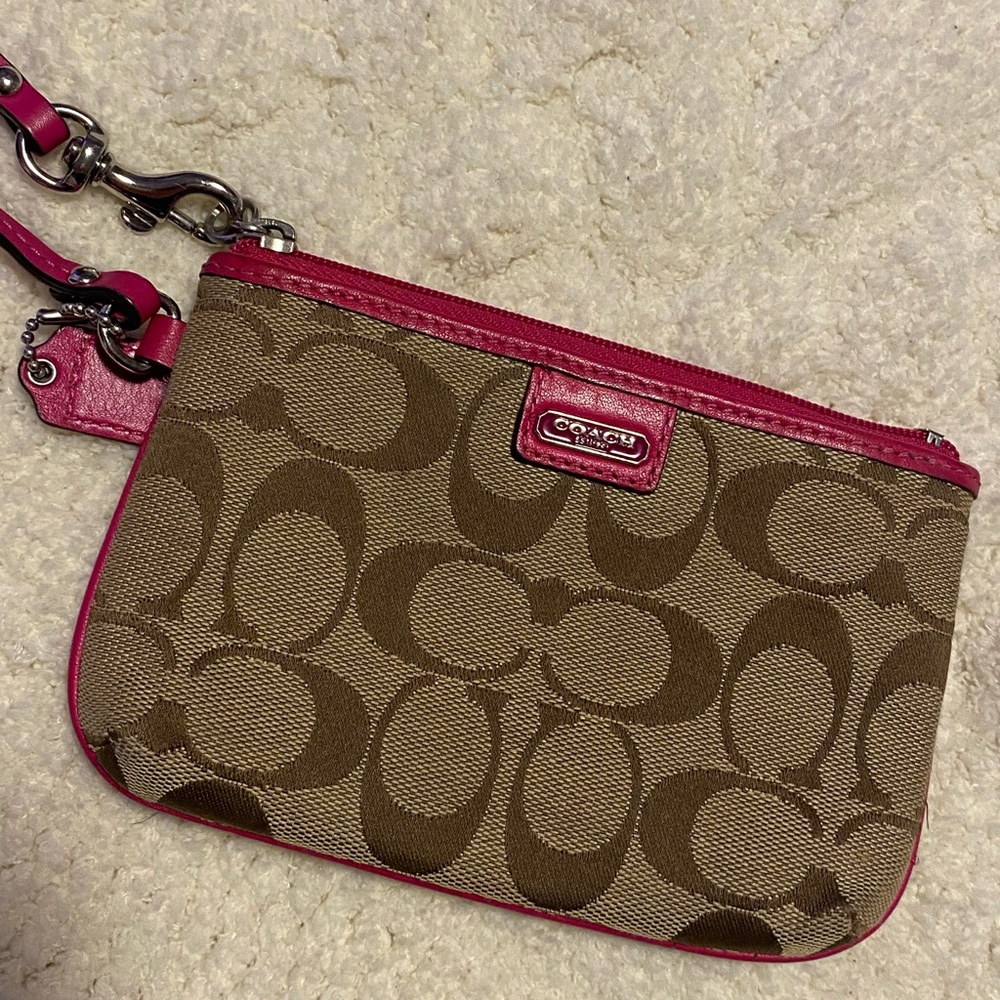 COACH | classic tan wristlet with pink lining